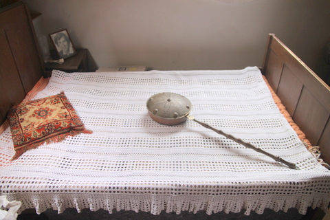 How our ancestors stayed warm without electricity by using a bedwarmer on a bed