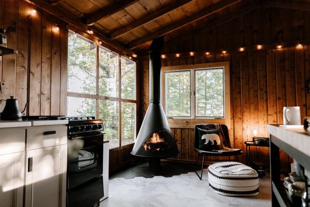 Scandinavian inspired log cabin with fur rug and log burner