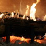 Logs burning on open fire when heating with firewood.